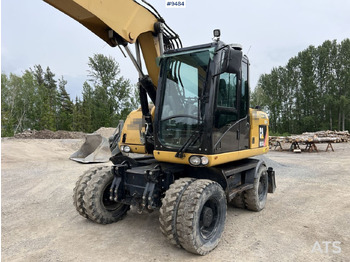 Excavadora de ruedas CAT M313D with tipping wagon and attachments (VIDEO): foto 4