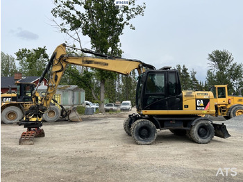 Excavadora de ruedas CAT M313D with tipping wagon and attachments (VIDEO): foto 2