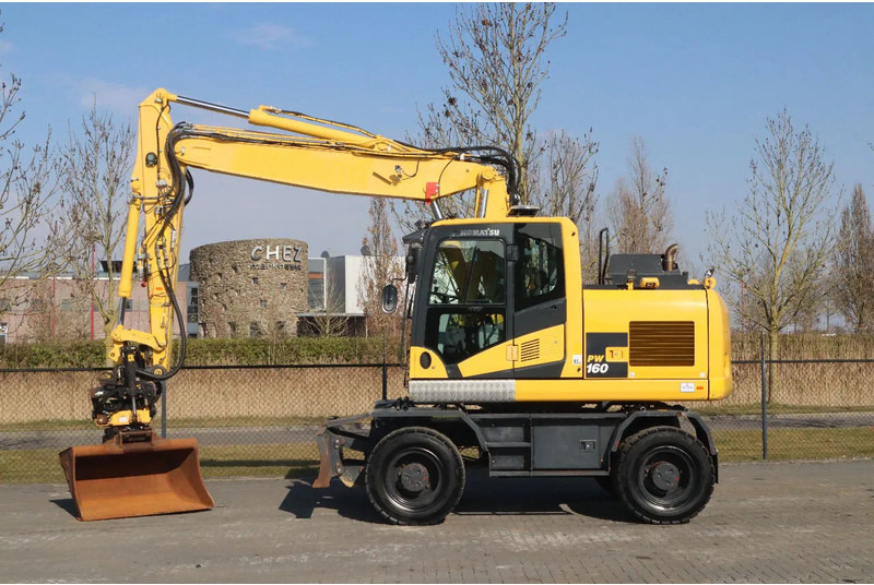 Komatsu PW160-11 | ENGCON TILTROTATOR | BUCKET | TRAILER HYDR. - Excavadora de ruedas: foto 1 Komatsu PW160-11 | ENGCON TILTROTATOR | BUCKET | TRAILER HYDR. - Excavadora de ruedas: foto 1