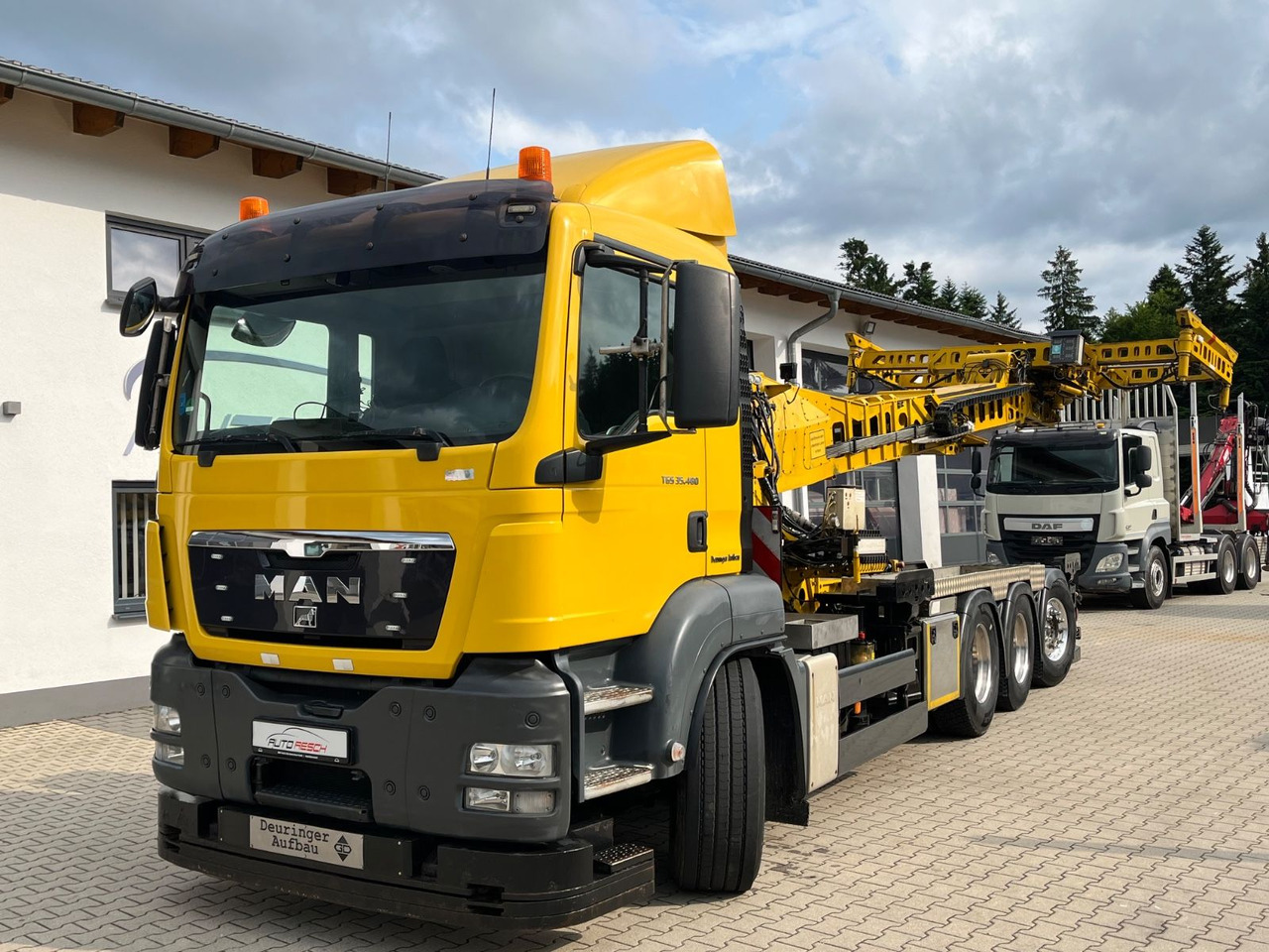 MAN TGS 35.480 8x4-4BL Deuringer Garagentransporter - Camión grúa: foto 1 MAN TGS 35.480 8x4-4BL Deuringer Garagentransporter - Camión grúa: foto 1