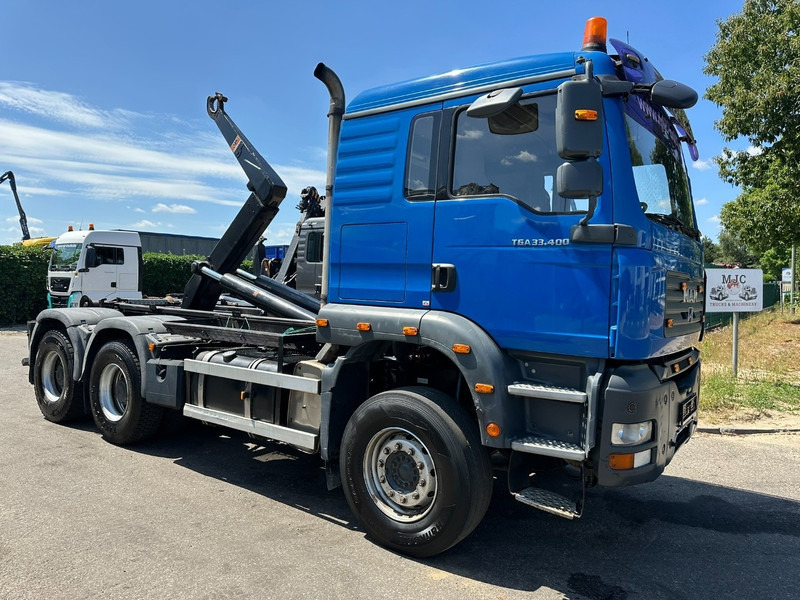 MAN TGA 33.400 6X4 HOOKLIFT AJK NHS20-4930mm - WB 3m60 - MANUAL ZF - STEEL SPRING / BLATT - BIG AXLES / AP ACHSEN - Camión multibasculante: foto 1 MAN TGA 33.400 6X4 HOOKLIFT AJK NHS20-4930mm - WB 3m60 - MANUAL ZF - STEEL SPRING / BLATT - BIG AXLES / AP ACHSEN - Camión multibasculante: foto 1