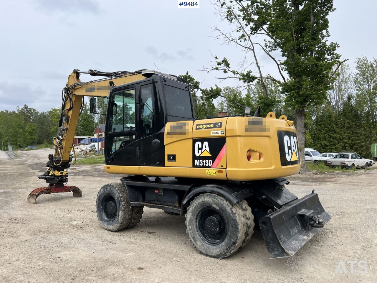 Excavadora de ruedas CAT M313D with tipping wagon and attachments (VIDEO): foto 5