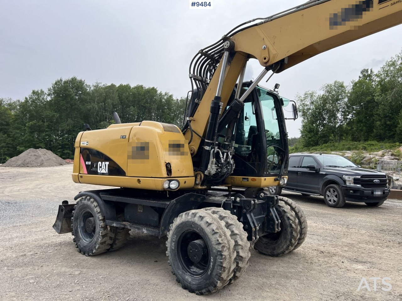 Excavadora de ruedas CAT M313D with tipping wagon and attachments (VIDEO): foto 11
