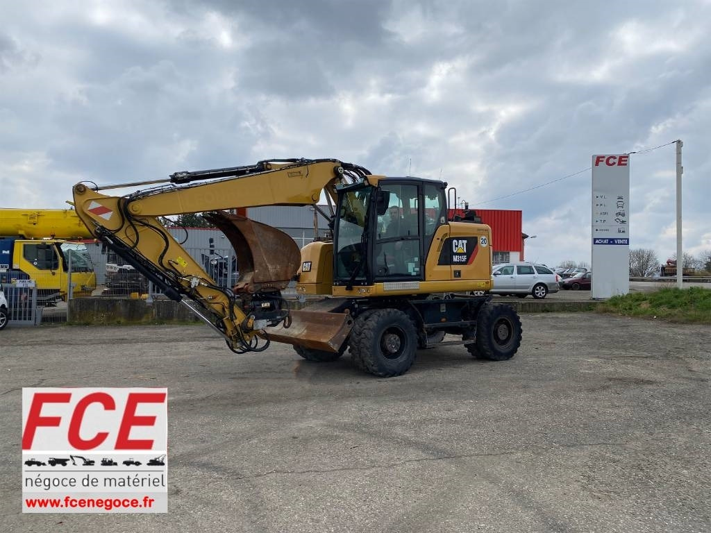 CAT M 315F /1er Main-Certificat CE Non accidenté - Excavadora de ruedas: foto 1 CAT M 315F /1er Main-Certificat CE Non accidenté - Excavadora de ruedas: foto 1