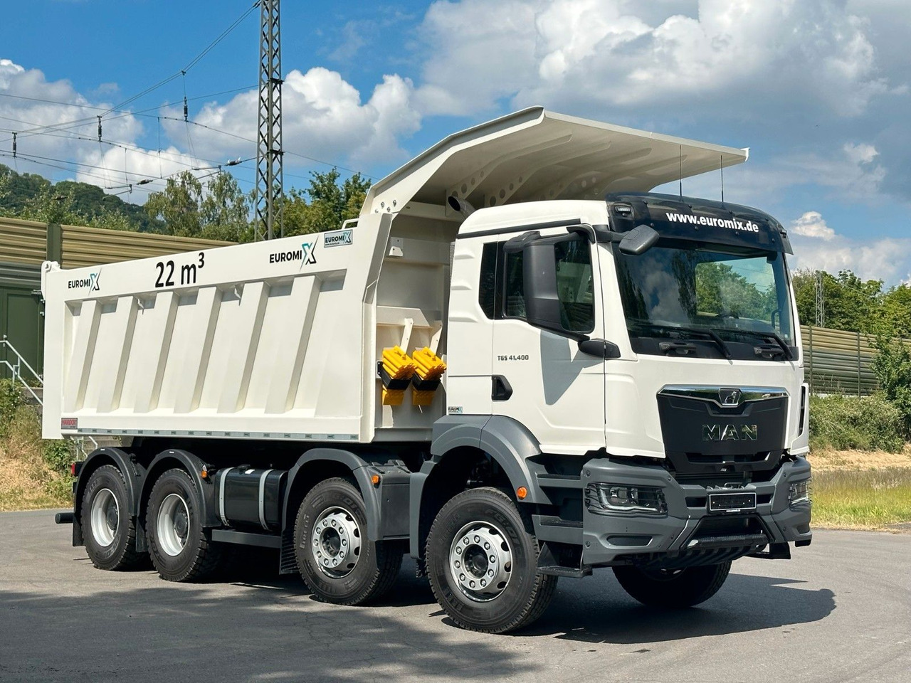 MAN TGS 41.440 8x4 EuromixMTP 22m³ Eckige Mulde - Camión volquete: foto 1 MAN TGS 41.440 8x4 EuromixMTP 22m³ Eckige Mulde - Camión volquete: foto 1
