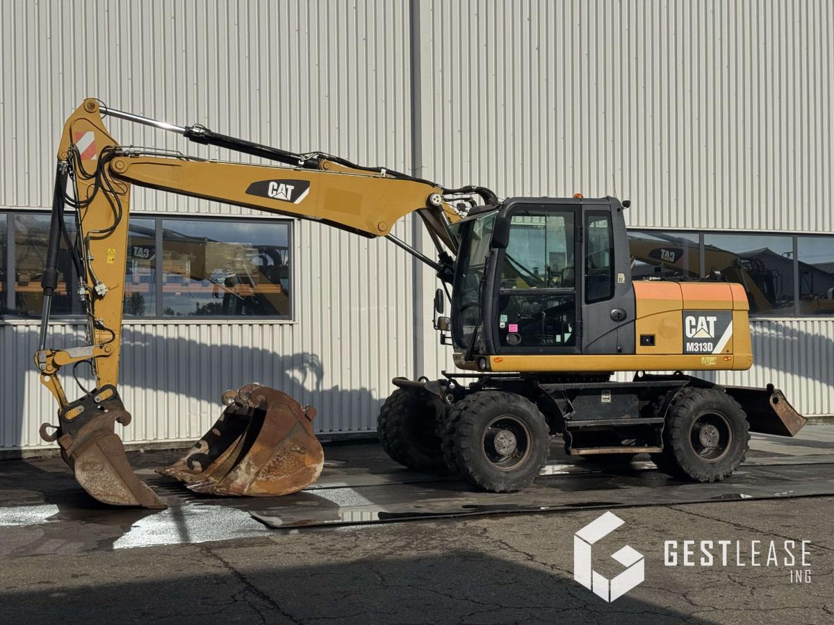 Caterpillar M313D - Excavadora de ruedas: foto 1 Caterpillar M313D - Excavadora de ruedas: foto 1