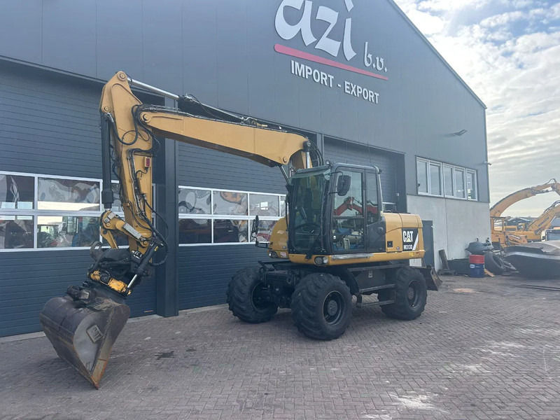 Caterpillar M313D - Excavadora de ruedas: foto 1 Caterpillar M313D - Excavadora de ruedas: foto 1