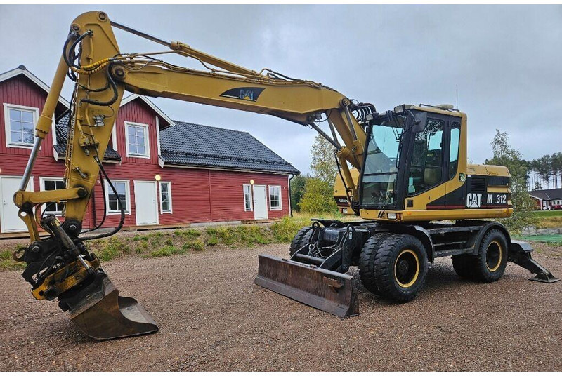 Caterpillar M312 Engcon EC20 tiltrotator - Excavadora de ruedas: foto 1 Caterpillar M312 Engcon EC20 tiltrotator - Excavadora de ruedas: foto 1