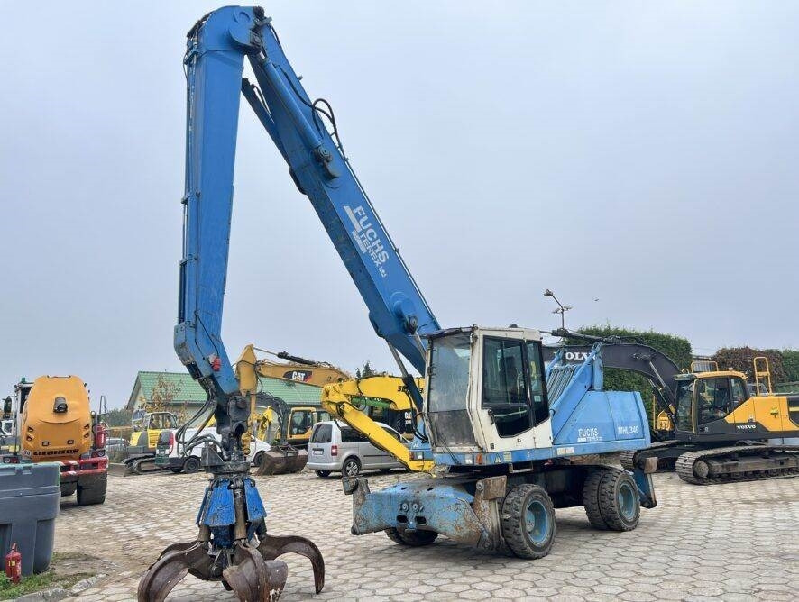 Fuchs MHL340 grab + generator - Manipulador de materiales: foto 1 Fuchs MHL340 grab + generator - Manipulador de materiales: foto 1