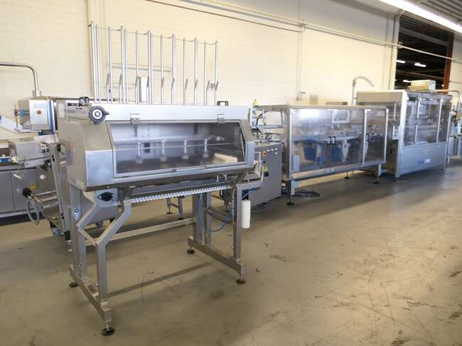 Tramper filling- and traysealing line GMD99-2 - Maquinaria de embalaje: foto 1 Tramper filling- and traysealing line GMD99-2 - Maquinaria de embalaje: foto 1