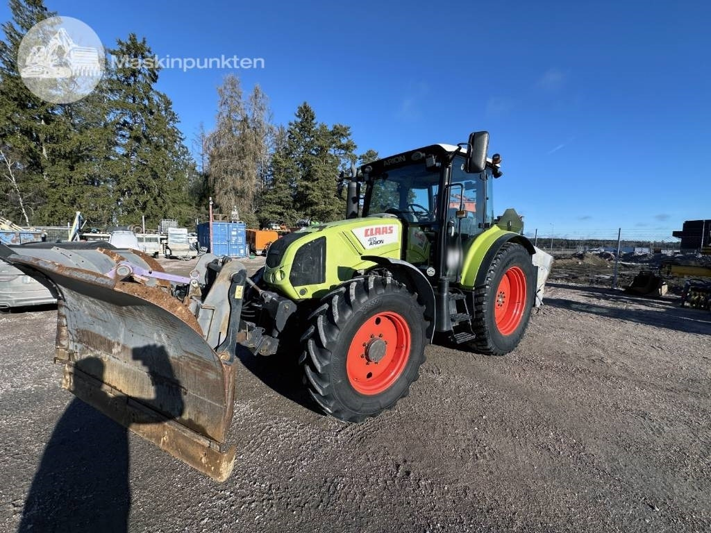 Claas Arion 410 - Tractor: foto 1 Claas Arion 410 - Tractor: foto 1