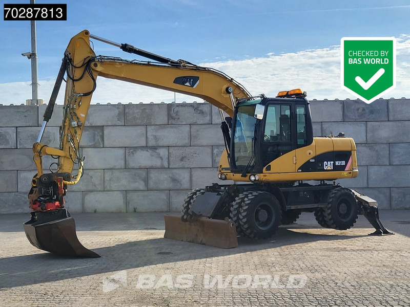 Caterpillar M313 D - Excavadora de ruedas: foto 1 Caterpillar M313 D - Excavadora de ruedas: foto 1