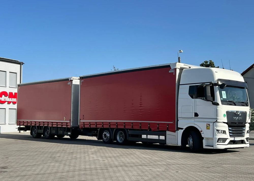 MAN TGX 26.470 z przyczepą Redos - Camión lona: foto 2 MAN TGX 26.470 z przyczepą Redos - Camión lona: foto 2