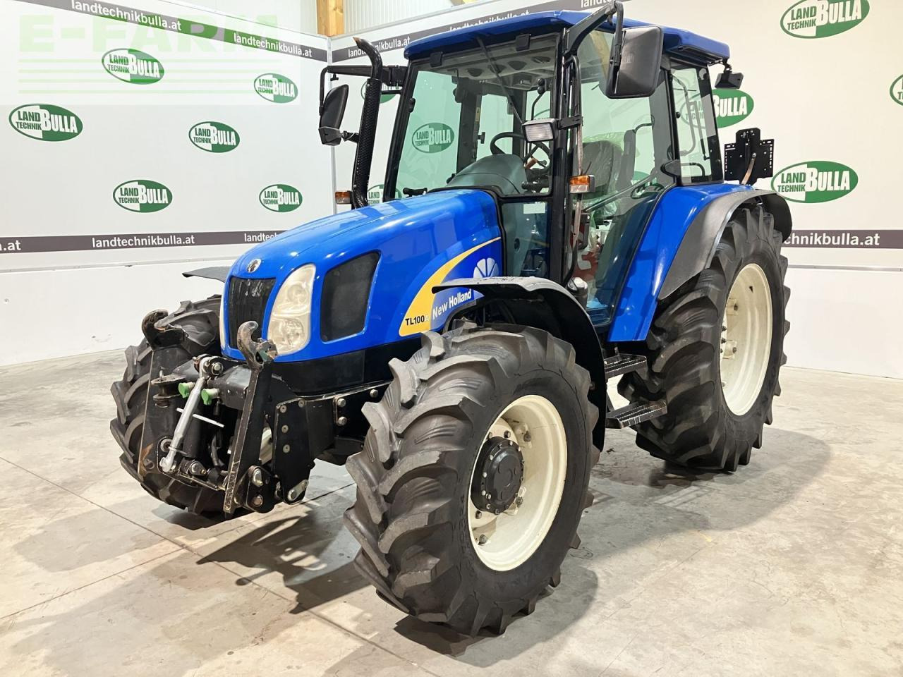 New Holland tl100a (4wd) A - Tractor: foto 1 New Holland tl100a (4wd) A - Tractor: foto 1