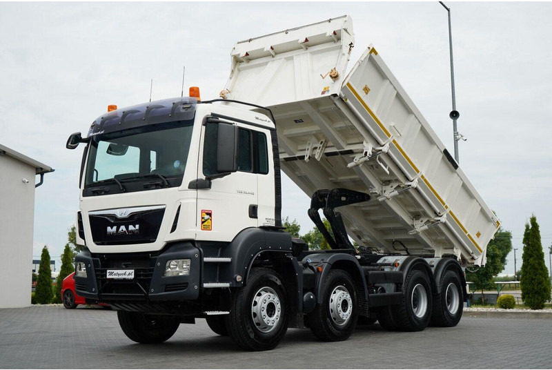 MAN TGS 35.440 / 8X4 / WYWROTKA 2 STR. / HYDROBURTA / BORDMATIC / ZA - Camión volquete: foto 1 MAN TGS 35.440 / 8X4 / WYWROTKA 2 STR. / HYDROBURTA / BORDMATIC / ZA - Camión volquete: foto 1