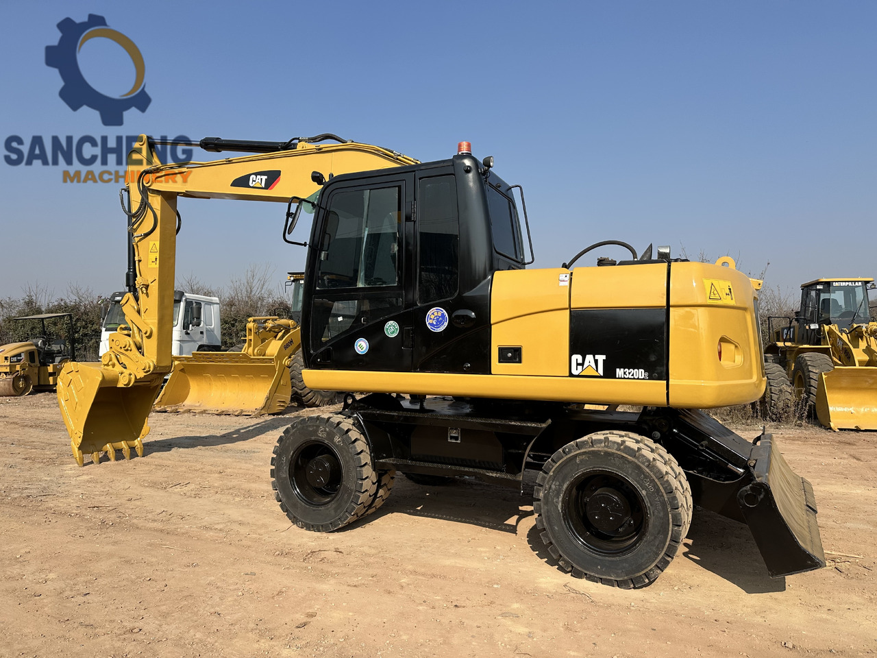 CATERPILLAR M320D2 - Excavadora de ruedas: foto 1 CATERPILLAR M320D2 - Excavadora de ruedas: foto 1