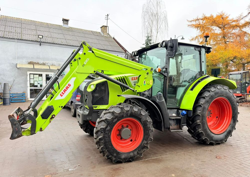 Claas Arion 420 - Tractor: foto 1 Claas Arion 420 - Tractor: foto 1
